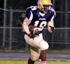 New Haven’s Brandon Fluker runs a kickoff back for a nice gain and good field position for the Bulldogs against East Noble. (By Blake Sebring of The News-Sentinel)