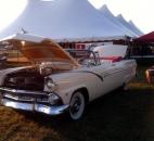 Joann Terlosky sits with her 1954 Ford Sunliner at the Allen County Fair’s Classic Car Cruise on Friday. Terlosky’s late husband, Art, bought this car for around $350 and re-built it from the frame up. The car is now worth about $50,000, she said. (Photo by Hana Hawash of The News-Sentinel)