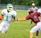 South Side’s Donovan Clark, left, tries to run around Concordia Lutheran’s Timmy English with the help of a block from Aaron Thomas on Friday at Zollner Stadium. (Photo by Don Converset of The News-Sentinel)