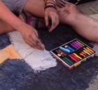 Madison Aschliman, an artist at the Fort Wayne Museum of Art's Chalk Walk at the Fort Wayne Newspapers Three Rivers Festival and junior at Snider High School, took her first chalk art class seven years ago. (Photo by Jaclyn Goldsborough of The News-Sentinel)