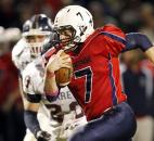 Heritage running back Will Knapke blasts up the middle of Garrett's defense on a counter play for a touchdown early in the third quarter of the Patriots' 56-2" victory on Friday at Heritage. Photo by Chad Ryan