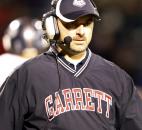 Garrett coach Chris DePew walks off the field after a timeout in the third quarter of the Railroaders' 56-2" loss on Friday at Heritage. Photo by Chad Ryan