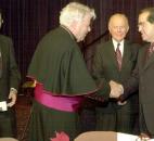 Bishop John D'Arcy shakes hands with Supreme Court Justice Antonin Scalia as U.S. District Judge William C. Lee and House of Rep. Mark Souder look on, before a brunch in October 2001 at the Grand Wayne Center. The justice was the guest speaker at the Red Mass Brunch. Photo by Ellie Bogue