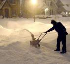 Debbie Debord digs out early Wednesday morning from her home in the 4600 block of Beaver Ave. Debord said she is ready to move to Florida.(Photo by Ellie Bogue of The News-Sentinel).