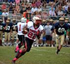 North Side sophomore Cliff Thomas looks for a hole around right end. (Photo by Blake Sebring of The News-Sentinel)