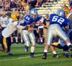Carroll’s Jimmy Crumley breaks through a Goshen tackle to start a long run for a touchdown during the first quarter Friday night. (By Blake Sebring of The News-Sentinel)