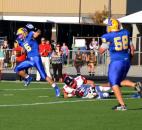 Homestead’s Conner Houser avoids the tackle of Huntington North’s Trenton Kern during a long second-quarter touchdown run Friday night. (By Blake Sebring of The News-Sentinel)