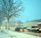 Cars and trucks slog through a heavy snowfall at on Broadway at Taylor Street. (By Bob Caylor of The News-Sentinel)