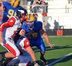 Huntington North quarterback Drew Schnitz breaks up the middle against Homestead’s defense Friday night. (By Blake Sebring of The News-Sentinel)