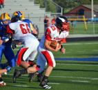 Huntington North running back Braydin Stell rushes outside against Homestead on Friday night. (By Blake Sebring of The News-Sentinel)