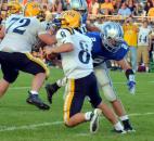 Carroll’s Drue Tranquill sacks Goshen quarterback Cade Jones late in the first quarter Friday night. (By Blake Sebring of The News-Sentinel)