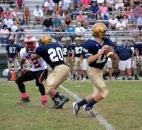 Bishop Dwenger quarterback Cody Miller steps up into the pocket to avoid the North Side rush and look downfield. (Photo by Blake Sebring of The News-Sentinel)