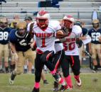 North Side quarterback C.J. Jackson takes off on a second-quarter scramble Friday night against Bishop Dwenger. (Photo by Blake Sebring of The News-Sentinel)