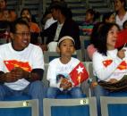 Soe, who was born in Burma, his daughter, Theresa, who was born in Fort Wayne, and wife, Ratana, who was born in Thailand, wait to hear former Burmese political prisoner Aung San Suu Kyi speak Tuesday morning at Memorial Coliseum. “She can change all our country,” Soe said. By Lisa Esquivel Long 