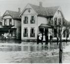 Residents watched the high water rise at their home at Marion and Second streets. (News-Sentinel file photo)