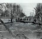 Water poured over the banks of the St. Joseph River along St. Joe Boulevard. The Tennessee Avenue Bridge is in the background. (News-Sentinel file photo)