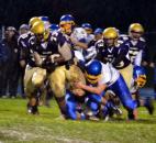 New Haven offensive lineman Freddie Jones falls forward for a 2-yard gain after grabbing a fumble out of the air in the first quarter. (By Blake Sebring of The News-Sentinel)