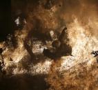 A riot police officer is engulfed by flames from gas bombs thrown by protesters during November clashes in Athens that stemmed from Greece's debt and budget crisis. Photo by The Associated Press