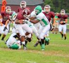 South Side’s Shaton Harris, right, starts to bring down Bryndon Williams of Concordia Lutheran during their game Friday at Zollner Stadium. (Photo by Don Converset of The News-Sentinel)