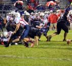 Leo running back Rance Harris looks for a way to get the ball back on a fumble late in the second quarter Friday night against Heritage. The Patriots’ Cole Gerardot recovered to set up a Heritage touchdown. (By Blake Sebring of The News-Sentinel)