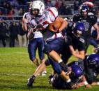 Jacob Roop charges up the middle from three yards out to score a touchdown in the second quarter Friday night against Leo. (By Blake Sebring of The News-Sentinel)