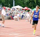 Alex Hess of Carroll uses the last of his energy in the last of his two laps in the 4x800-meter relay. (Photo by Gannon Burgett for The News-Sentinel)