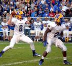 Homestead quarterback Matt Skowronek looks deep with help from the blocking of Frank Martin. (By Blake Sebring of The News-Sentinel)