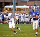 Carroll’s Drue Tranquill looks outside before being tackled by Homestead’s Trevor Stanley. (By Blake Sebring of The News-Sentinel)