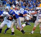 Carroll’s Jimmy Crumley runs up the middle against Homestead’s defense in the first quarter Friday night. (By Blake Sebring of The News-Sentinel)