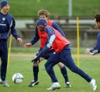 Midfielder Damarcus Beasley, center, of Chicago Fire, practices with the US national soccer team during a practice session in Warsaw, Monday March 29, 2004, two days before they meet Poland in an international friendly soccer match. 