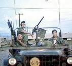 Kyle Herrick and two of his buddies pose for a picture while serving in Vietnam. Herrick is in the back on the left. (The News-Sentinel archives)