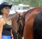 Kasie Boles, 17, prepares her horse for the 4-H Horse Showmanship contest at the Allen County Fair Wednesday. Her horses show name is Another Shot of Whiskey. (Photo by Wes Young of The News-Sentinel)