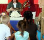 Beth Wood pulls a snake from a bag Thursday at the Allen County Fair Indiana Wild Animal Show. (Photo by Wes Young of The News-Sentinel)