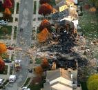 Two homes were leveled and numerous neighboring homes were damaged in a massive November explosion that sparked a huge fire and killed two people in this Indianapolis neighborhood. Three people have been arrested for setting off the blast and charged with murder and arson. Authorities are weighing whether to pursue the death penalty against them. Photo by The Indianapolis Star