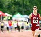 Kody Jones of Concordia Lutheran sprints past the grandstands as he completes a lap in the 4x800-meter relay. (Photo by Gannon Burgett for The News-Sentinel)
