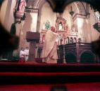 Bishop John D'Arcy performs a Rite of Reparation for the desecration of St. Paul's Catholic Church on Washington Boulevard in February 2000. Bishop D'Arcy blessed water and carried out the sprinkling of the altar, walls and the people. News-Sentinel file photo