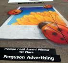 An almost 3-D effect earned Ferguson Advertising an award in the weekend Chalk Walk contest on Main Street during the Fort Wayne Newspapers Three Rivers Festival. (Photo taken 7-14-13)