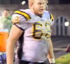 Snider senior offensive lineman Travis Leonard looks on from the sidelines as the Panthers’ defense is on the field against Bishop Dwenger on Friday at Zollner Stadium. Snider won 43-0 to clinch the Summit Athletic Conference championship. (By Don Converset of The News-Sentinel)