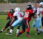 Bishop Luers running back Jaquale Cooper tries to find a way around Wayne linebacker Joseph Griffin. (By Blake Sebring of The News-Sentinel)