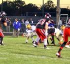 The Bishop Luers defense prepares to stop a play by Bishop Dwenger on Friday at Luersfield. Knights players from left to right are Jaylon Smith, Nicholas Deiser, Nick Morken, and Matt Williamson. The Knights beat the Saints 58-2". Photo by By Don Converset of The News-Sentinel