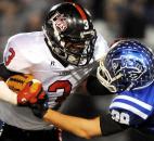 Bishop Luers Charles Gaston tries to shed the tackle of Tipton’s Gunnar Norred on Friday during their Class 2A regional game at Tipton. Luers won 22-12. Photo by By Rob Edwards for The News-Sentinel