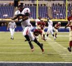 Running back Jaylon Smith runs through the Evansville Mater Dei secondary for one of his two touchdowns during Bishop Luers' 41-17 victory in the 2011 Class 2A state finals at Lucas Oil Stadium in Indianapolis. Smith, the 2011 News-Sentinel Prep Football Player of the Year, had a game-high 130 rushing yards as the Knights won their third consecutive Class 2A state championship. (Photo by Chad Ryan of INMedia Source)