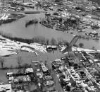 A view of downtown, with a flooded Sherman Boulevard and Sherman Bridge in the foreground.