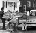Dick Limburg and Sally Pallsen help move Kari Towns of 1505 E. Columbia Ave. after the area was ordered evacuated March 17.