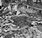 A view from the Pemberton dike. Although the neighborhood was saved, much of the area around the dike was littered with pumps, barrels and sandbags.