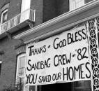 A resident displays a sign of gratitude for the sandbaggers' efforts.