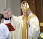 Bishop John D'Arcy, right, reads a blessing during Easter Mass in April 2009 at the Cathedral of the Immaculate Conception. News-Sentinel file photo