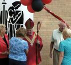 From left, Judy Hershberger and Sandy Matthys chat with Bishop John D'Arcy in August 2008 after Bishop Luers High School celebrated its 50th anniversary with a Mass and rededication of the school. On the right are classmates from 1962, Steve McArdle and Mary Jane Millikan. They  were all in the first graduating class from Bishop Luers High School. Photo by Ellie Bogue