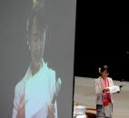 Aung San Suu Kyi smiles as she reads a very long question Tuesday morning during a question-and-answer session at Memorial Coliseum. By Ellie Bogue 