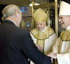 Bishop John D'Arcy, center, and Bishop Kevin C. Rhoades, right, greet Joe Ryan, left,  CFO of the Catholic Diocese of Fort Wayne-South Bend, after Mass in November 2009. Bishop Rhoades will be the new bishop of the diocese. News-Sentinel file photo